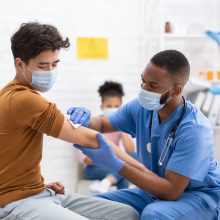 doctor giving patient vaccine